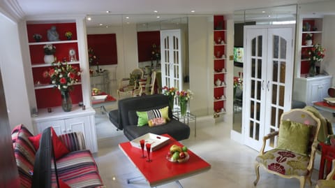 LARGE SITTING ROOM with  striped sofa opening in a large single bed  