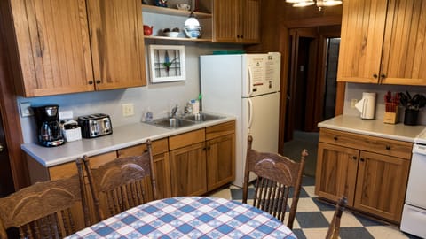 Full sized refrigerator, toaster and coffee maker.