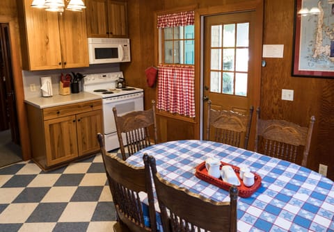 Kitchen with entry to back porch and yard. Full sized stove/oven and microwave.