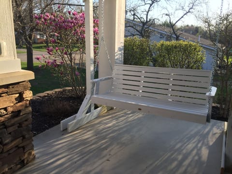 Enjoy the breeze and a good conversation on the namesake swing!