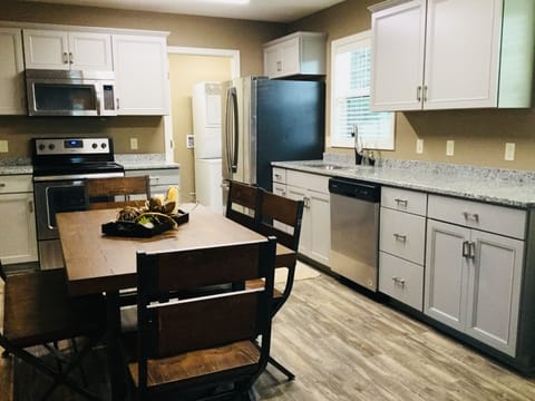 Kitchen with granite counter tops, stainless appliances,  Keurig Coffee mak




