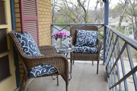 Comfortable balcony seating to enjoy a cup of coffee or a glass of wine