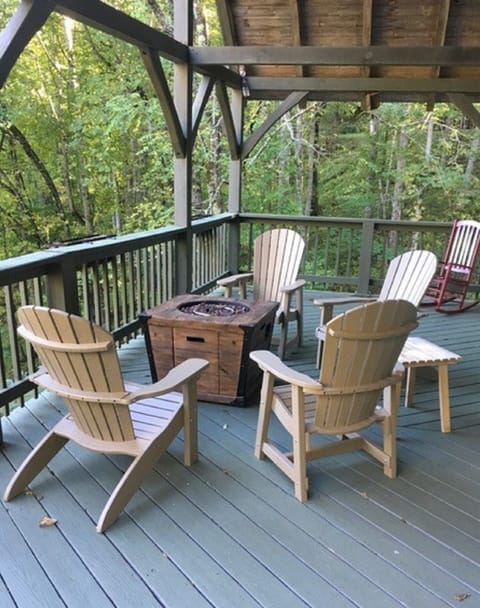 Covered deck with chairs and fire pit 