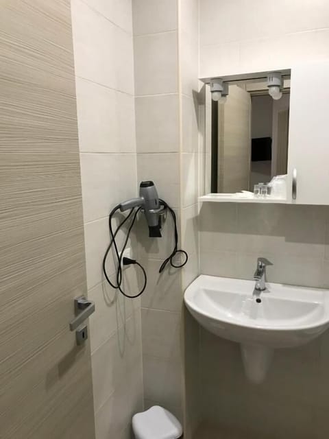 Shower, free toiletries, hair dryer, slippers