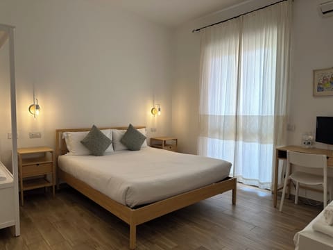 Deluxe Room | Premium bedding, down comforters, blackout drapes, free WiFi