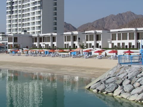 Private beach, beach umbrellas, beach towels, water skiing