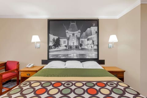 Desk, laptop workspace, blackout drapes, iron/ironing board