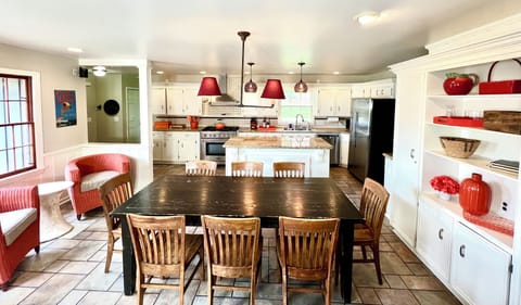 KITCHEN/GREAT ROOM: table seats 12 with leaves, SMART TV, bluetooth speakers