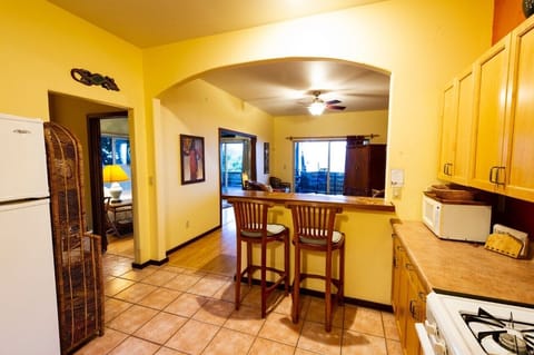 Kitchen, dining room, living room with ocean view.