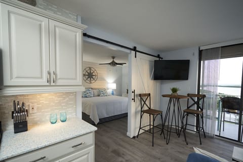 open concept, with optional privacy barn door and 2 flat screen smart Tvs!