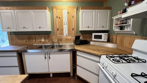 Well appointed, fully stocked kitchen with full size refrigerator and gas stove.