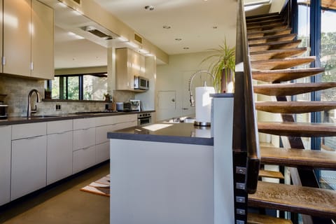 Stairs off kitchen leading up to the Master Level