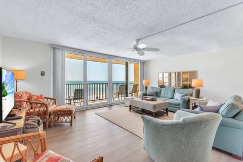 Spacious Living Area with Balcony Access and Gulf Views