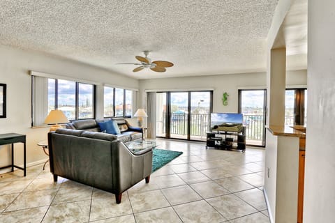 Open Living area opening up to large waterfront balcony