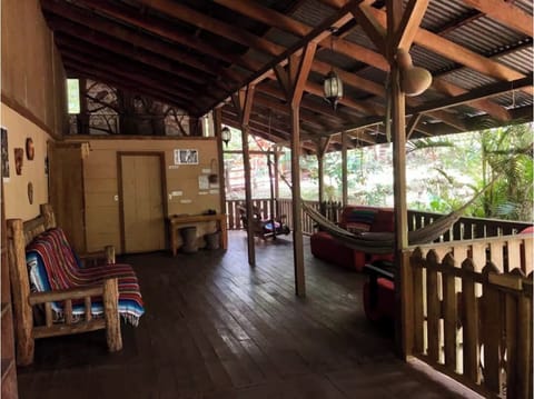 The spacious porch is the main living area of this historic original farmhouse. 