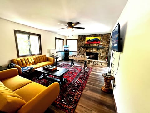 Game room with arcade, Nintendo, foosball, mini pool, and large TV