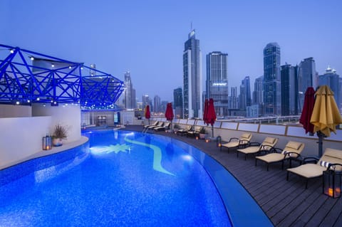 Outdoor pool, open 7:00 AM to 8:00 PM, pool umbrellas, sun loungers