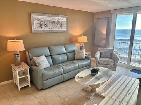 Brand new living room furniture featuring a leather, dual reclining power sofa