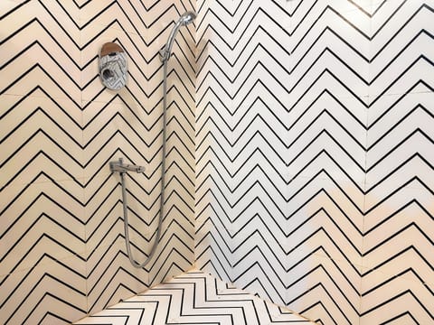 Superior AC Room With King bed | Bathroom | Shower, hydromassage showerhead, slippers, toilet paper