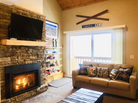 Warm, spacious, living area with gorgeous mountain views. 