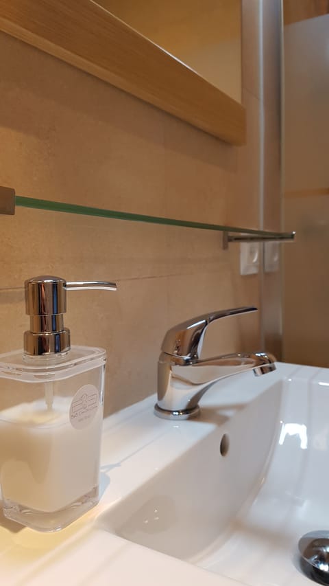 Bathroom amenities | Shower, hair dryer, bathrobes, slippers