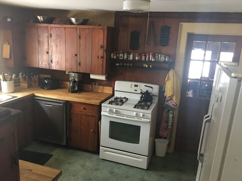kitchen gas stove and side by side refrigerator


