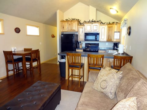 counter height table and chairs with additional seating at the counter