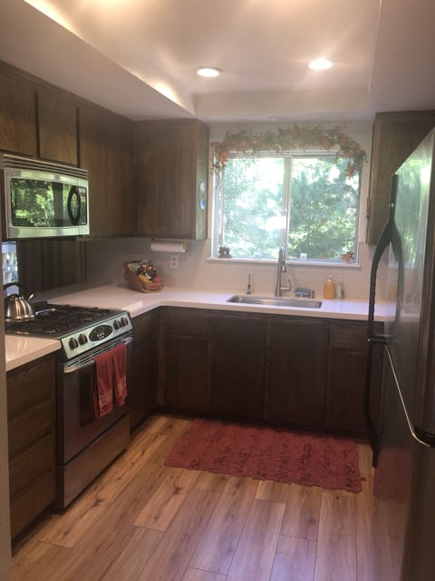 New countertops, tile, sink, recessed lighting, and appliances.