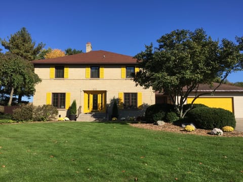 FRONT OF HOUSE: garage & large driveway, ample parking, private backyard/pool