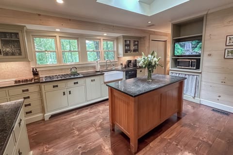 Enjoy a view of the forest as you create meals and memories