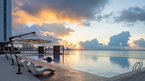 Seasonal outdoor pool, open 7:00 AM to 10:00 PM, sun loungers
