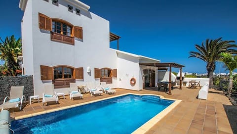 A beautiful private pool surrounded by a landscaped Canarian garden.