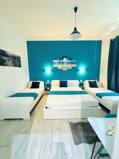 Triple Room, City View | Minibar, desk, blackout drapes, soundproofing