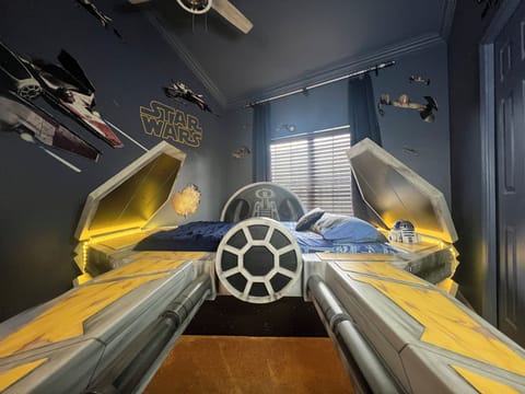 We're hyper about space in Anakin's Star Wars Jedi StarFighter! Full sized bed.