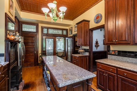 Kitchen- looking toward W/D utility and  sunny breakfast room off circular porch