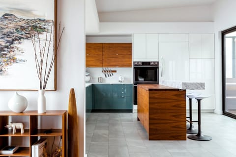 State-of-the-art kitchen with marble bar, Wolf range and instant hot water tap.