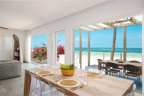 Moja Private Beachfront Suite, Amani Home Zanzibar | Living area | 30-inch flat-screen TV with satellite channels, TV, video-game console
