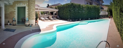Seasonal outdoor pool, open 9:00 AM to 1:00 PM, sun loungers