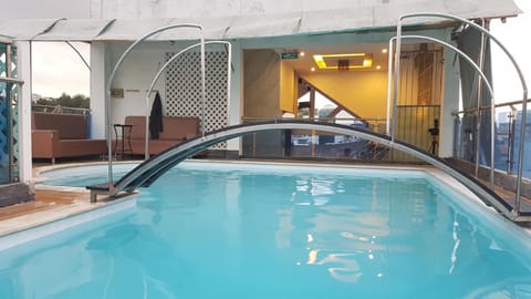 Outdoor pool, open 8:00 AM to 4:00 PM, pool umbrellas, sun loungers