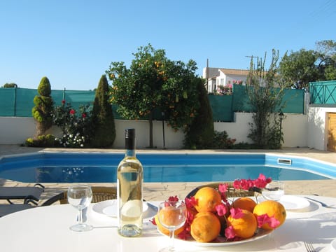 Al Fresco with fresh oranges and a glass of Wine