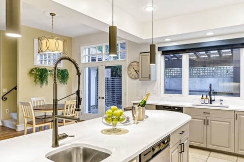 Two sinks and an island for gathering to eat.