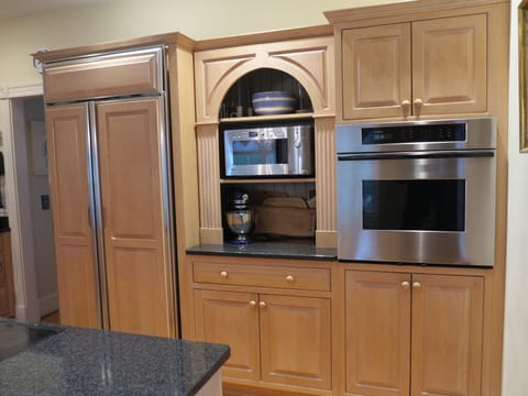 Kitchen fridge, microwave and oven