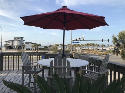 Front balcony with beautiful views of the beach.  Crosswalk at light to beach.