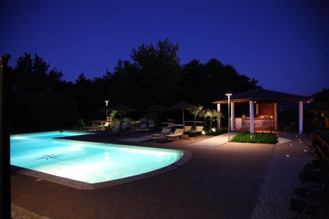Seasonal outdoor pool, open 10:00 AM to 7:00 PM, pool umbrellas