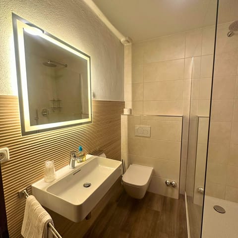 Family Room, Multiple Beds, Balcony, Garden Area (5 beds room) | Bathroom | Combined shower/tub, hair dryer, heated floors, towels