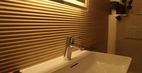 Family Room, Multiple Beds, Balcony, Garden Area (5 beds room) | Bathroom | Combined shower/tub, hair dryer, heated floors, towels