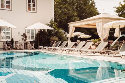 Indoor pool, outdoor pool, open 7:00 AM to 10:00 PM, pool umbrellas