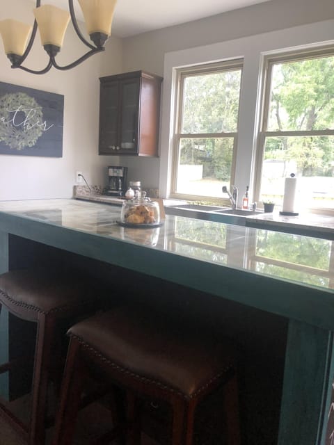 Kitchen island with seating overlooking picture window