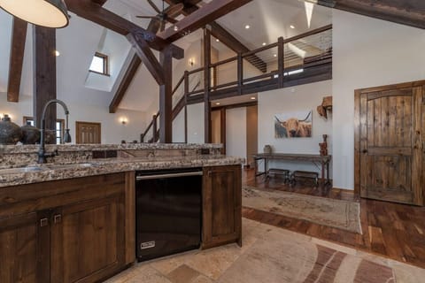 Kitchen view - stairs leading to loft and basement