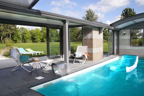 Indoor pool, open 9:00 AM to 9:00 PM, pool umbrellas, sun loungers